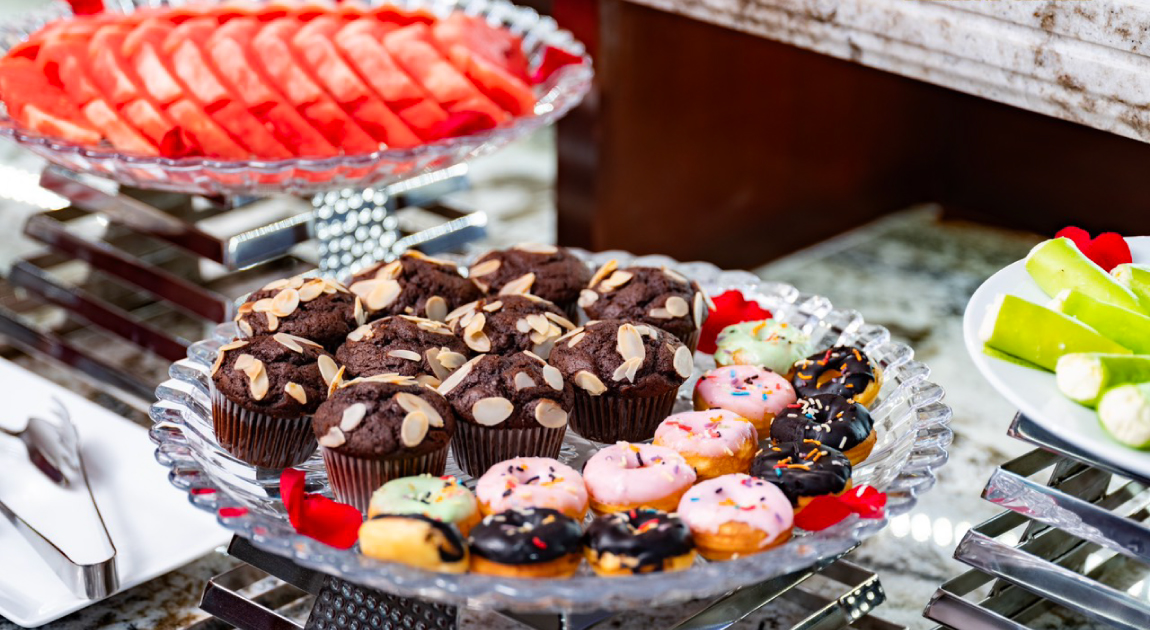 Trays of fruits and cakes.