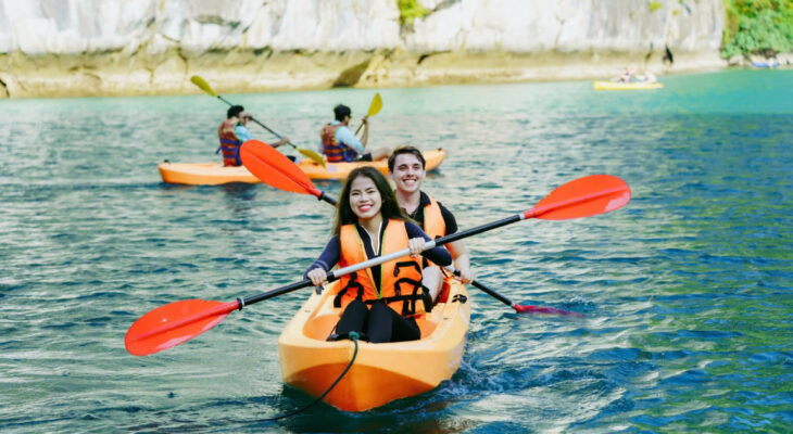 Halong Odyssey Cruise guests kayak in Halong Bay.